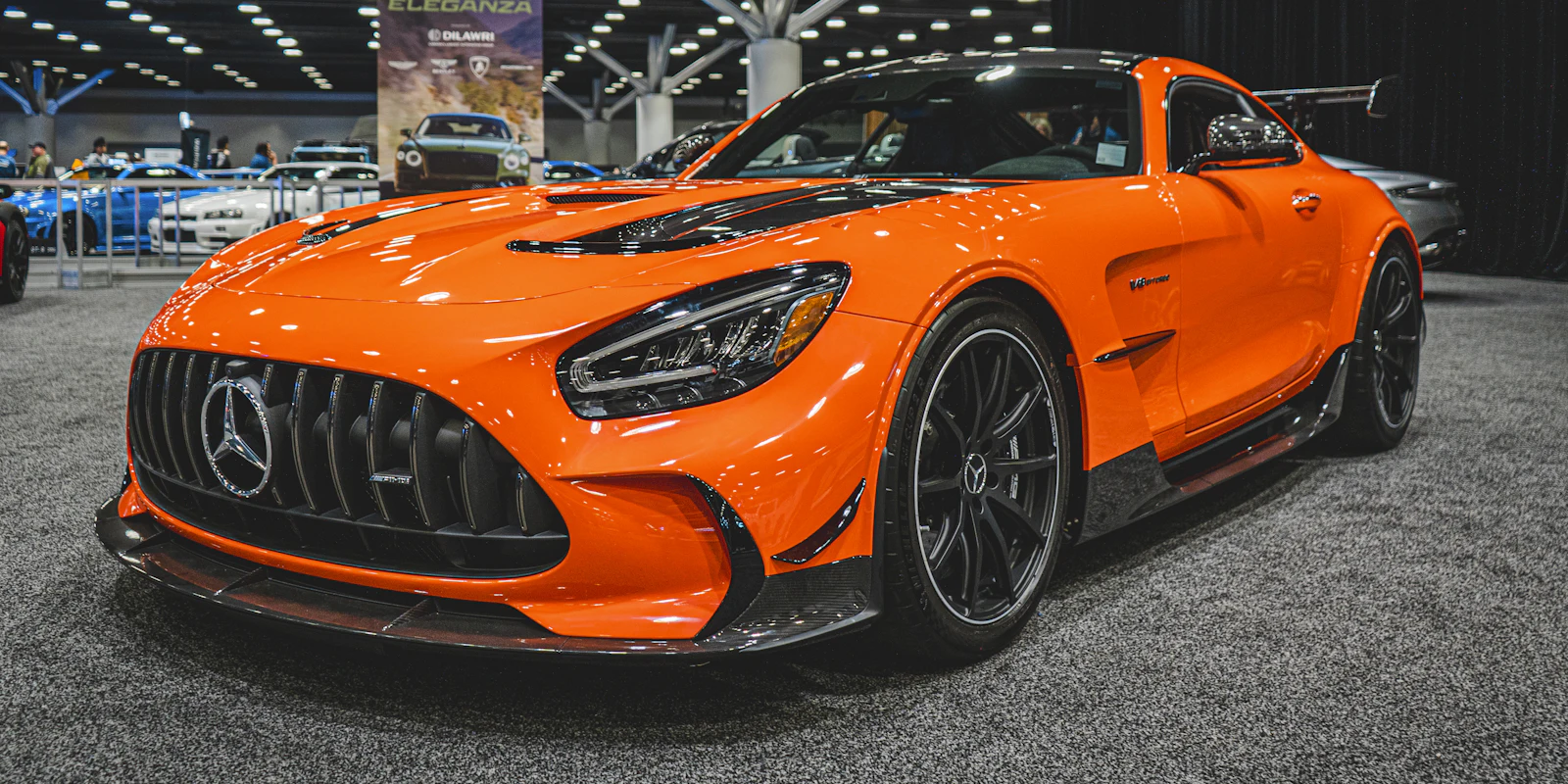 Orange Mercedes-AMG GT R at a car show
